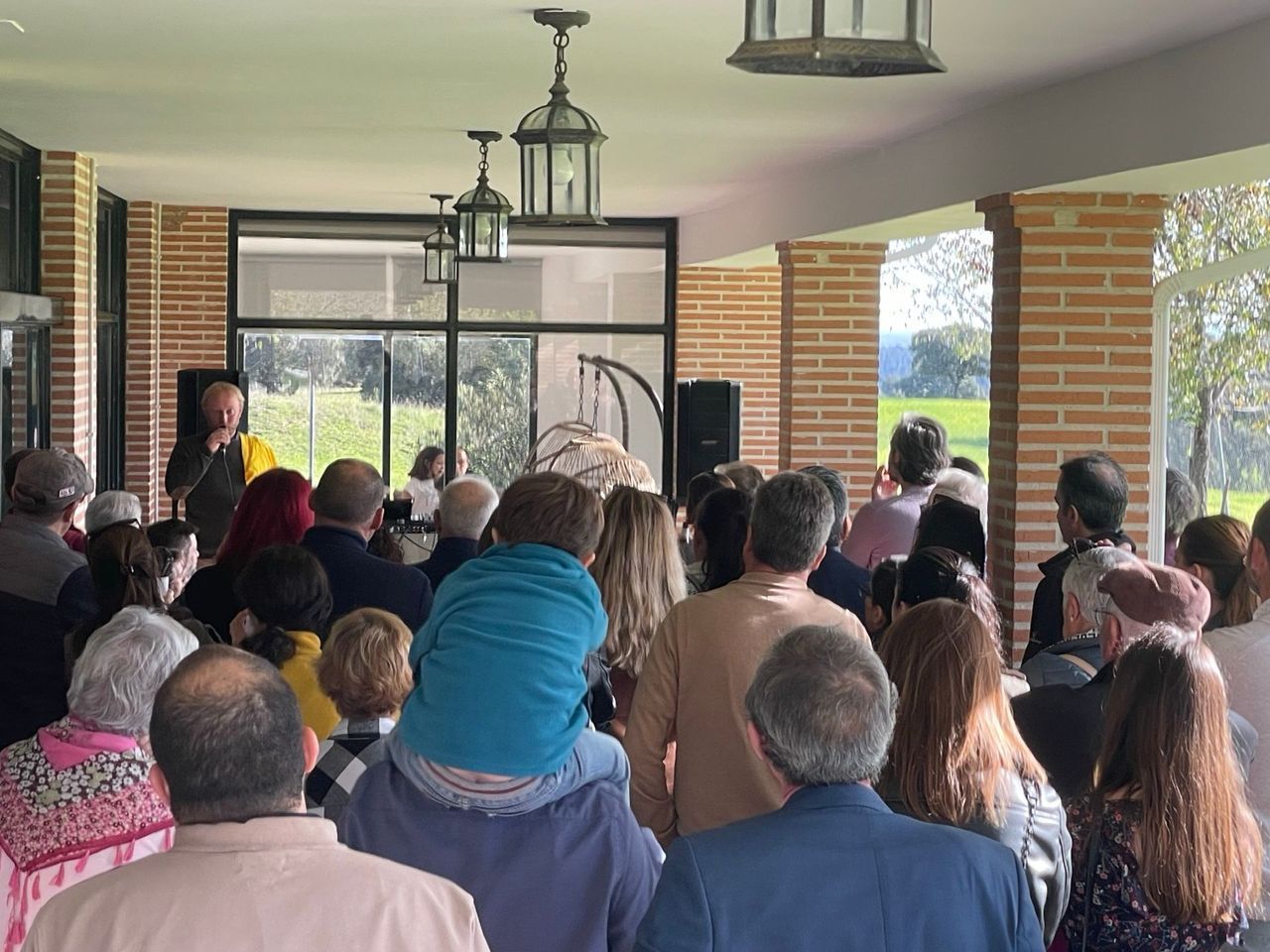Crowd celebrating the opening of the coworking space